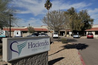 
              FILE - This Jan. 25, 2019, file photo shows the Hacienda HealthCare facility in Phoenix. The long-term care facility in Arizona is shutting down a unit where an incapacitated woman was raped and later gave birth, officials with Hacienda HealthCare announced Thursday, Feb. 7, 2019. Hacienda officials say they're working with state agencies to develop a plan to move the remaining 37 patients to other facilities.  (AP Photo/Matt York, file)
            