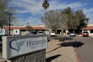 FILE - This Jan. 25, 2019, file photo shows the Hacienda HealthCare facility in Phoenix. The long-term care facility in Arizona is shutting down a unit where an incapacitated woman was raped and later gave birth, officials with Hacienda HealthCare announced Thursday, Feb. 7, 2019. Hacienda officials say they're working with state agencies to develop a plan to move the remaining 37 patients to other facilities. (AP Photo/Matt York, file)