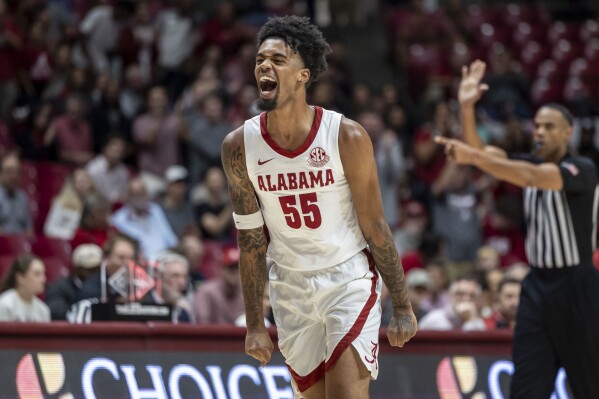 Alabama guard Aaron Estrada (55) celebrates a 3-pointer against Morehead State during the first half of an NCAA college basketball game, Monday, Nov. 6, 2023, in Tuscaloosa, Ala. (AP Photo/Vasha Hunt)