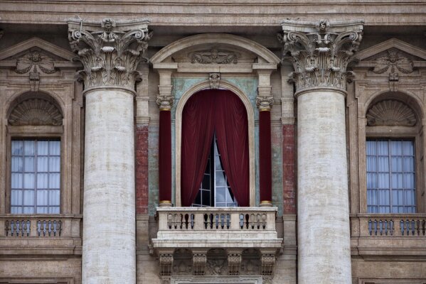 FILE - A view of the balcony on the facade of St. Peter's Basilica, Monday, March 11, 2013. (AP Photo/Oded Balilty)