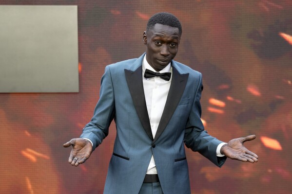 Khaby Lame poses for photographers upon arrival at the premiere of the film 'Oppenheimer' in London, July 13, 2023. (Scott Garfitt/Invision/AP File)