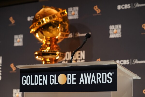 A replica of a Golden Globe statue appear behind the podium at the nominations for the 81st Golden Globe Awards at the Beverly Hilton Hotel on Monday, Dec. 11, 2023, in Beverly Hills, Calif. The 81st Golden Globe Awards will be held on Sunday, Jan. 7, 2024. (AP Photo/Chris Pizzello)