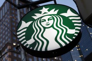 FILE - A Starbucks sign hangs outside a Starbucks coffee shop in downtown Pittsburgh on June 26, 2019. The coffee giant said Thursday, Sept. 1, 2022, that longtime PepsiCo executive Laxman Narasimhan will join Starbucks on Oct. 1, after relocating from London to Seattle, where Starbucks is based. (AP Photo/Gene J. Puskar, File)
