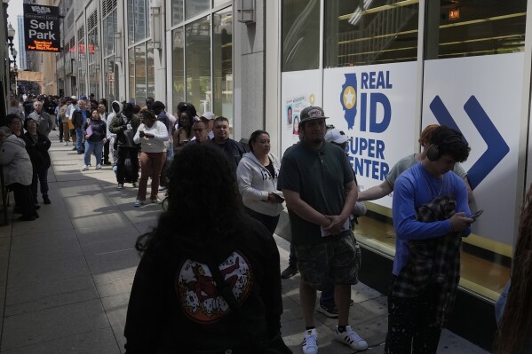People line up to apply for Real ID at a Real ID Supercenter in downtown Chicago, Tuesday, May 6, 2025. (AP Photo/Kiichiro Sato)