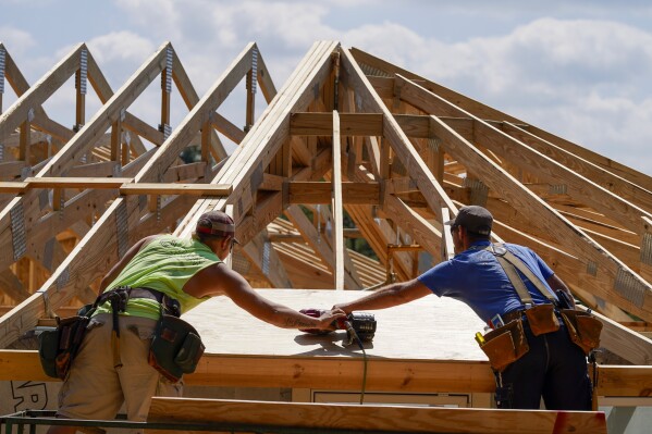 File - Carpenters work on a home on Sept. 19, 2023, in Marshall, N.C. On Thursday, May 30, 2024, Freddie Mac reports on this week's average U.S. mortgage rates. (AP Photo/Chris Carlson, File)
