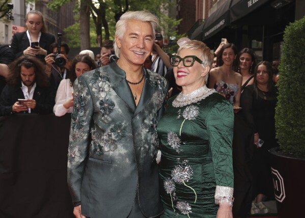 Baz Luhrmann, left, Catherine Martin depart The Mark Hotel prior to attending The Metropolitan Museum of Art's Costume Institute benefit gala celebrating the opening of "Sleeping Beauties: Reawakening Fashion" on Monday, May 6, 2024, in New York. (Photo by CJ Rivera/Invision/AP)