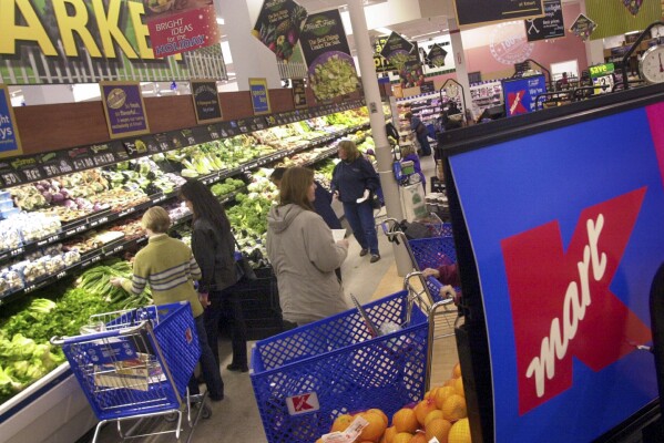 FILE - Shoppers look for groceries at a Kmart store in Bloomfield Hills, Mich., on Nov. 21, 2001. (AP Photo/Paul Sancya, File)