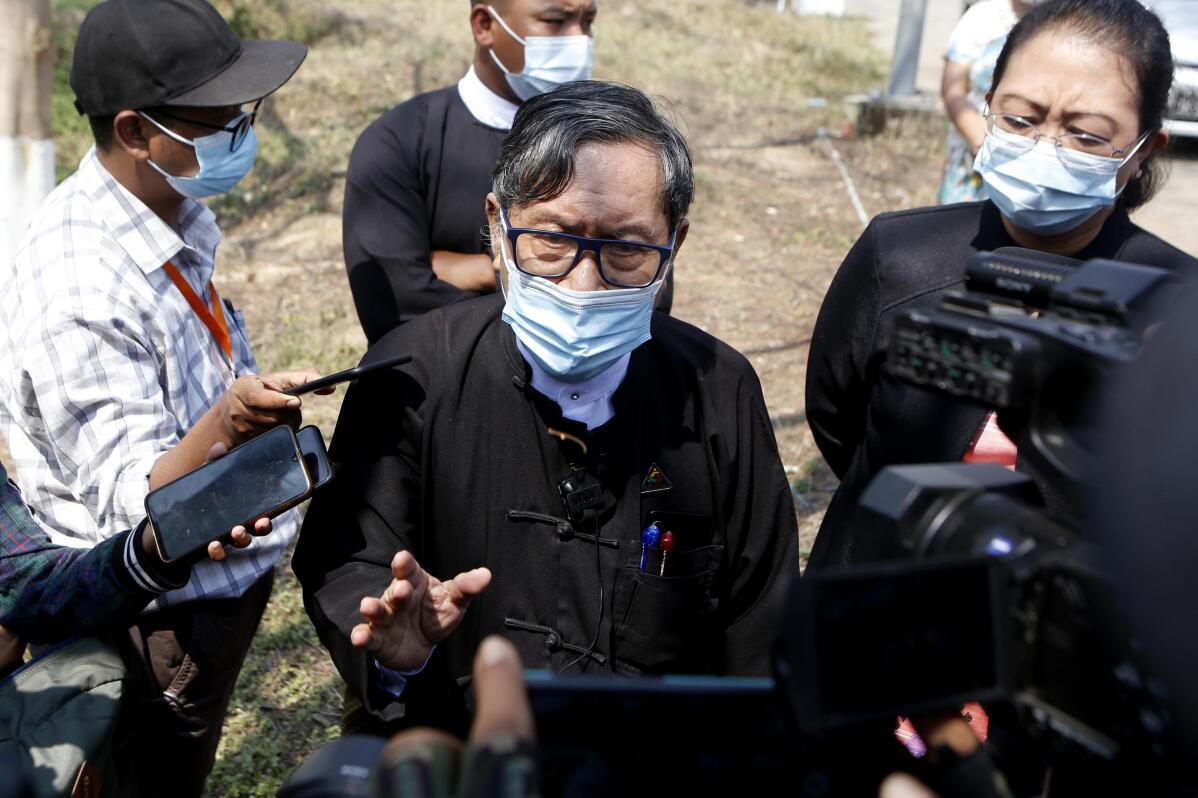 FILE - Khin Maung Zaw, center, a lawyer assigned by the National League for Democracy party to represent deposed Myanmar leader Aung San Suu Kyi, speaks to journalists outside the Zabuthiri Township Court in Naypyitaw, on March 1, 2021. A leading human rights organizations has charged that lawyers representing opponents and critics of Myanmar’s military government face harassment and attacks, ranging from threats and arrests to unfair trials and even torture. Human Rights Watch says such actions reflected a broader attack on the country’s justice system. (AP Photo)
