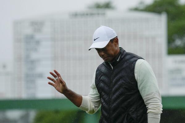 Tiger Woods waves after his weather delayed second round of the Masters golf tournament at Augusta National Golf Club on Saturday, April 8, 2023, in Augusta, Ga. (AP Photo/Charlie Riedel)