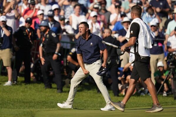 Bryson DeChambeau celebrates after a birdie on the 18th hole during the final round of the PGA Championship golf tournament at the Valhalla Golf Club, Sunday, May 19, 2024, in Louisville, Ky. (AP Photo/Jeff Roberson)