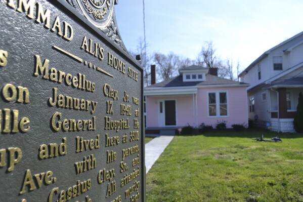 FILE - In this March 18, 2016 file photo, the childhood home of Muhammad Ali is seen in Louisville, Ky. The house where Ali grew up dreaming of boxing fame is up for sale. The house was converted into a museum offering a glimpse into the boxing great's formative years. It went on the market Tuesday, June 4, 2024 along with two neighboring homes. (AP Photo/Dylan Lovan, File)