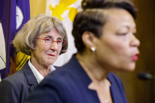 FILE - Anne Kirkpatrick, left, listens as New Orleans Mayor LaToya Cantrell, right, announces Kirkpatrick as her nominee to head the New Orleans Police Department, Sept. 11, 2023, at City Hall in New Orleans. Kirkpatrick, a veteran police official who has served as chief of departments in Spokane, Wash., and Oakland, Calif., won City Council approval as New Orleans' new police chief Thursday, Oct. 19, on a 6-1 vote. (Chris Granger/The Times-Picayune/The New Orleans Advocate via AP, File)