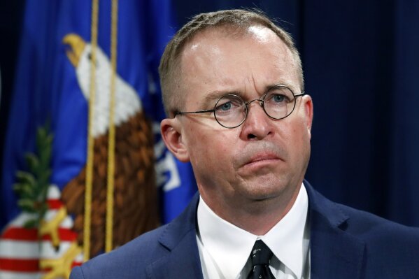 
              FILE- In this July 11, 2018, file photo Mick Mulvaney, acting director of the Consumer Financial Protection Bureau (CFPB), and Director of the Office of Management, listens during a news conference at the Department of Justice in Washington. Seth Frotman, the nation's top government official overseeing the $1.5 trillion student loan market resigned on Monday, citing what he says is the White House's open hostility toward protecting student loan borrowers. Frotman is the latest high-level departure from the CFPB since Mulvaney took over in late November. (AP Photo/Jacquelyn Martin, File)
            