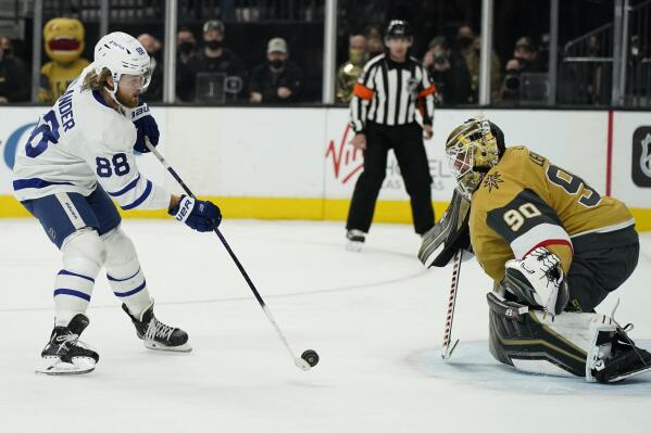 Toronto Maple Leafs right wing William Nylander (88) shoots to score on Vegas Golden Knights goaltender Robin Lehner (90) in a shootout of an NHL hockey game Tuesday, Jan. 11, 2022, in Las Vegas. (AP Photo/John Locher)