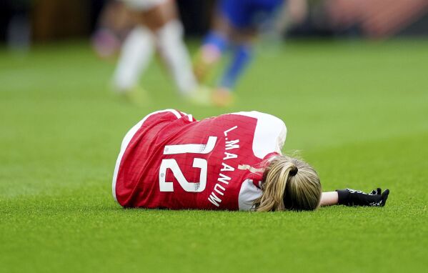 Arsenal's Frida Maanum goes down during the FA Women's Continental Tyres League Cup Final at Molineux Stadium, Wolverhampton, England, Sunday March 31, 2024. (David Davies/PA via AP)