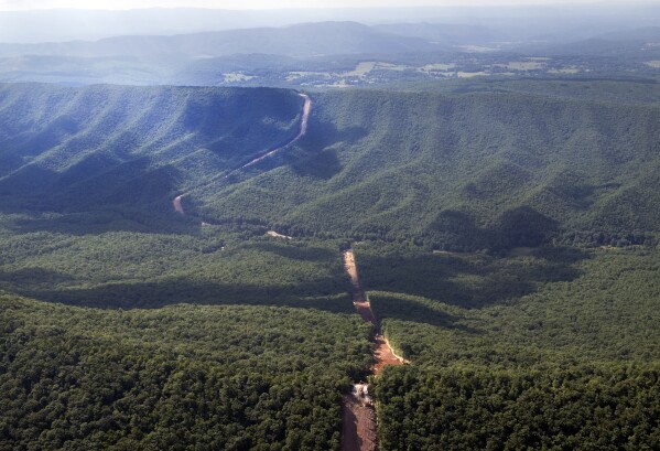 The Mountain Valley Pipeline route on Brush Mountain, July 18, 2018. The Supreme Court is allowing construction to resume on a contested natural-gas pipeline that is being built through Virginia and West Virginia. Work had been halted by the federal appeals court in Richmond, even after Congress ordered the project's approval as part of the bipartisan bill to increase the debt ceiling. President Joe Biden signed the bill into law in June. (Heather Rousseau/The Roanoke Times via AP)