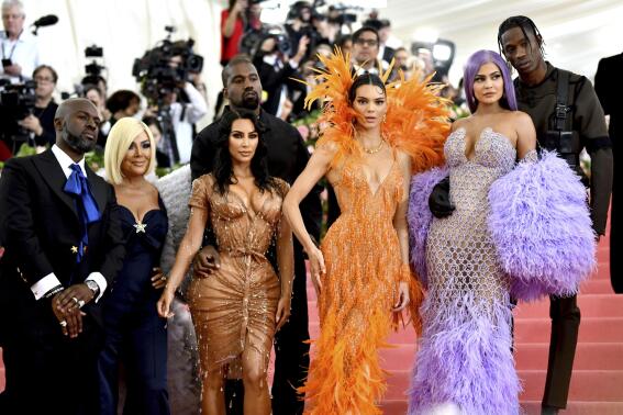 FILE - Corey Gamble, from left, Kris Jenner, Kim Kardashian, Kanye West, Kendall Jenner, Kylie Jenner and Travis Scott attend The Metropolitan Museum of Art's Costume Institute benefit gala in New York on May 6, 2019. Their reality series "Keeping Up with the Kardashians" will end the series with their 20th season. (Photo by Charles Sykes/Invision/AP, File)
