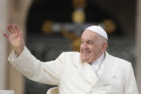 Pope Francis smiles as he waves faithful at the end of his weekly general audience in St. Peter's Square, at the Vatican, Wednesday, Nov. 22, 2023. (AP Photo/Andrew Medichini)