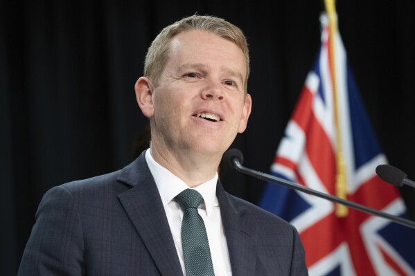 New Zealand's Prime Minister Chris Hipkins announces an end to all COVID-19 restrictions during a press conference at the Parliament in Wellington, Monday, Aug. 14, 2023. New Zealand removed the last of its remaining COVID-19 restrictions, marking the end of a government response to the pandemic that was watched closely around the world. (Mark Mitchell/NZ Herald via AP)