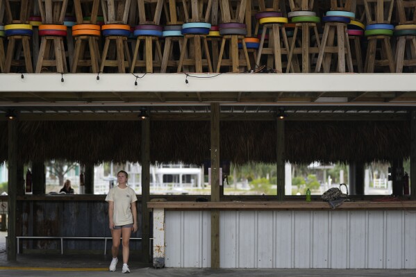 Bar stools fill the open second story at the Sea Hag Marina in Steinhatchee, Fla., as employees prepare for the expected arrival of Hurricane Idalia, Tuesday, Aug. 29, 2023. (AP Photo/Rebecca Blackwell)