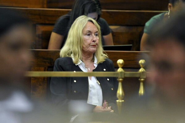 FILE - June Steenkamp, mother of Reeva Steenkamp, inside the High Court of Appeal in Bloemfontein, South Africa, Friday, Nov. 3, 2017. (AP Photo, File)