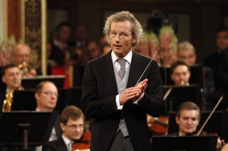 Austrian maestro Franz Welser-Möst conducts the Vienna Philharmonic Orchestra during the traditional New Year's concert at the Golden Hall of the Musikverein in Vienna, Austria, Jan. 1, 2013. In a statement Thursday, Jan. 11, 2024, Welser-Möst said he will retire as music director of the Cleveland Orchestra in June 2027, ending a 25-season tenure that will be the longest in the ensemble's history. (AP Photo/Ronald Zak, File)