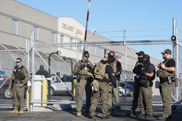 Security personnel stand in front of Delaney Hall, a recently re-opened immigration detention center, in Newark, N.J., Wednesday, May 7, 2025. (AP Photo/Seth Wenig)