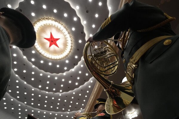CORRECTS TO THAT THE REHEARSAL IS HELD BEFORE THE OPENING SESSION OF CPPCC - Chinese military band members rehearse, before the opening session of the Chinese People's Political Consultative Conference, or CPPCC, in the Great Hall of the People in Beijing, Monday, March 4, 2024. (AP Photo/Ng Han Guan)
