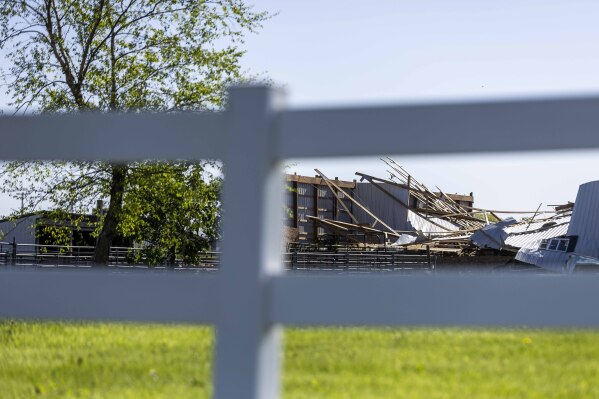 Scenes from homes near the insection of 64th Avenue and Perry Street show the damaging results of high winds and heavy rainfall in Drenthe east of Zeeland, Mich. on Friday, May 16, 2025. (Isaac Ritchey/The Grand Rapids Press via AP)