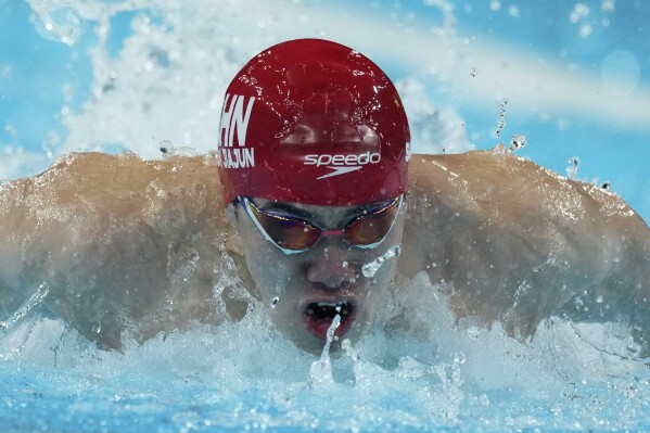 China's Sun Jiajun competes in the men's 4x100-meter medley relay final at the Summer Olympics in Nanterre, France, Sunday, Aug. 4, 2024. (AP Photo/Natacha Pisarenko)