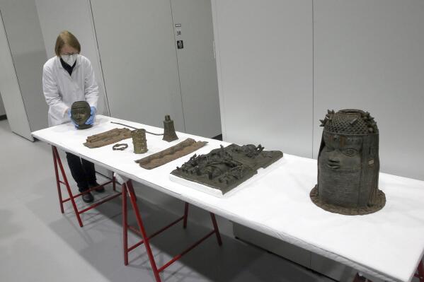 Benin bronzes are being assembled for return to Nigeria at the Ethnological Museum Dahlem in Berlin on Dec. 6, 2022. Germany's foreign minister will personally take 20 artifacts looted by Europeans during colonial times back to Nigeria when she visits to Africa's most populous country next week, her spokesman said Friday. The symbolic gesture follows an agreement earlier this year between Berlin and Abuja that will see all 514 so-called Benin Bronzes held in German museums handed back to Nigeria. (Wolfgang Kumm/dpa via AP)