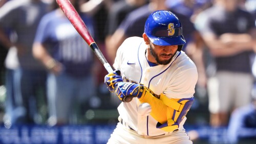 Seattle Mariners' Jose Caballero is hit by a pitch with the bases loaded by Tampa Bay Rays relief pitcher Jason Adam, driving in Teoscar Hernandez to score, during the seventh inning of a baseball game, Sunday, July 2, 2023, in Seattle. (AP Photo/Lindsey Wasson)