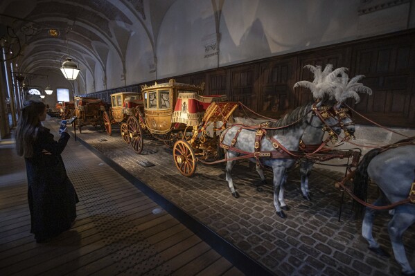 The gallery of Coaches in the Great Stables, in Versailles, Thursday, April 25, 2024. The Gallery of Coaches contains one of the largest collections of coaches in Europe. (AP Photo/Aurelien Morissard)
