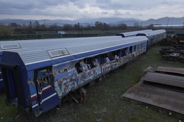 An aerial view of the wagons and other parts recovered from a train wreck, near Larissa city, central Greece, Wednesday, Feb. 28, 2024. Greece's deadliest rail disaster killed 57 people when a passenger train slammed into an oncoming cargo train. The tragedy shocked the country, with many of the victims being university students. (AP Photo)