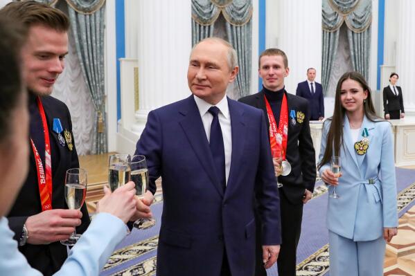Russian President Vladimir Putin meets with Russian athletes during an awarding ceremony for the Russian Olympic Committee's medalists of the XXIV Olympic Winter Games in Beijing and members of the Russian Paralympic team in the Kremlin in Moscow, Russia, Tuesday, April 26, 2022. (Mikhail Klimentyev, Sputnik, Kremlin Pool Photo via AP)
