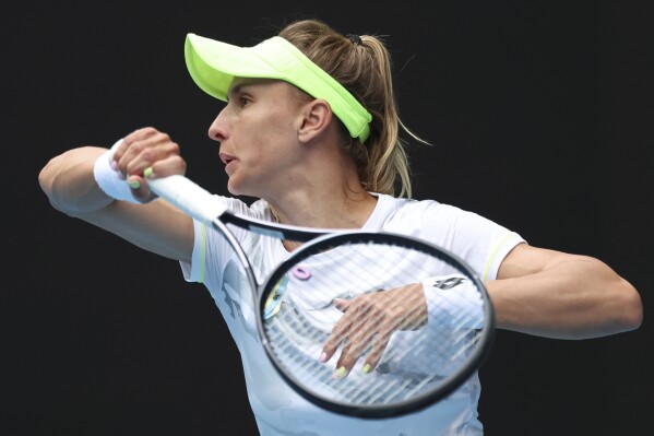 Lesia Tsurenko of Ukraine plays a forehand return to Aryna Sabalenka of Belarus during their third round match at the Australian Open tennis championships at Melbourne Park, Melbourne, Australia, Jan. 19, 2024. (AP Photo/Asanka Brendon Ratnayake, File)