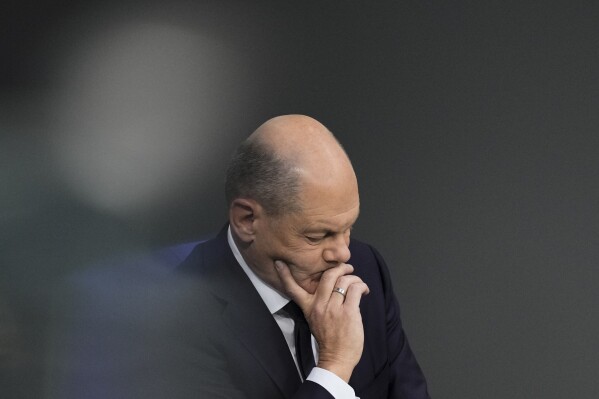 FILE - German Chancellor Olaf Scholz attends a debate fter his speech at the parliament Bundestag in Berlin, Germany, on Oct. 19, 2023. Chancellor Olaf Scholz says Germany needs to start deporting “on a large scale” migrants who don’t have the right to stay in the country, adding to increasingly tough talk on migration since his coalition performed badly in two state elections earlier this month. Scholz’s comments were published Friday, Oct. 20, 2021, as a leading German opposition figure called for the center-left chancellor to dump his quarrelsome coalition partners and instead form a government with conservatives to deal with migration issues. (AP Photo/Markus Schreiber)
