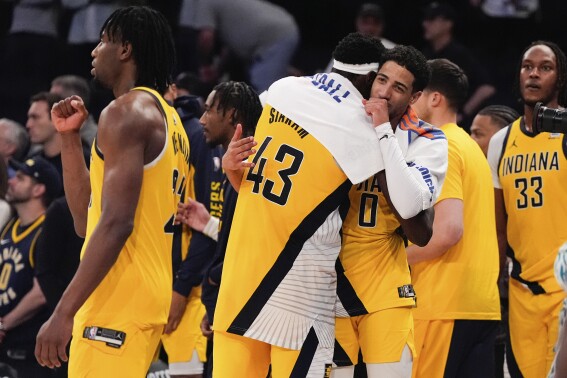 Indiana Pacers forward Pascal Siakam (43) and guard Tyrese Haliburton (0) celebrate following Game 7 in an NBA basketball second-round playoff series against the New York Knicks, Sunday, May 19, 2024, in New York. (AP Photo/Julia Nikhinson)