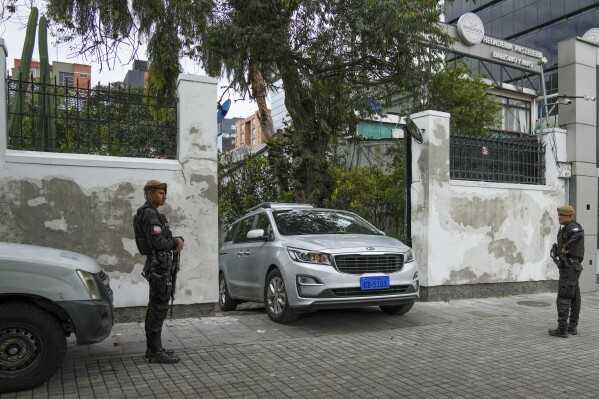A car with diplomatic license plates leaves the Mexican embassy in Quito, Ecuador, Friday, April 5, 2024. Ecuador on Thursday declared Mexico's ambassador in Quito persona non grata due to recent statements made by the Mexican president Andrés Manuel López Obrador on the 2023 presidential elections in Ecuador.  (AP Photo/Dolores Ochoa)