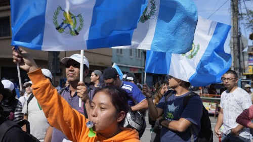 Demonstrators protest in front of Guatemala's Attorney General's office building in Guatemala City, Thursday, July 13, 2023. The Attorney General's Office announced on July 12 that a judge had suspended the legal status of the Seed Movement political party for alleged violations when it gathered the necessary signatures to form. The party's presidential candidate had been set to compete in a runoff election on Aug. 20. (AP Photo/Moises Castillo)