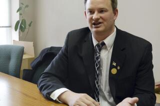 FILE - South Dakota Attorney General Jason Ravnsborg speaks in Sioux Falls, S.D., on Feb. 23, 2014. The South Dakota Senate on Tuesday, April 26, 2022, approved the rules for an impeachment trial of the state's attorney general for his conduct surrounding a 2020 fatal car crash, laying out a two-day proceeding in June that gives just hours to either side to argue their case. (AP Photo/Dirk Lammers, File)