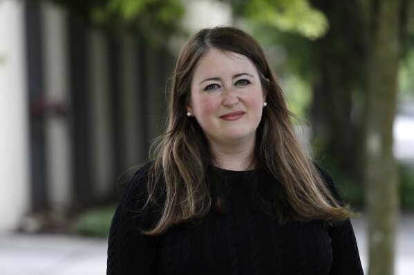 In this photo taken Tuesday, May 26, 2020, Dayna Lurie poses for a photo in Seattle. Lurie found out that she was a victim of unemployment benefits fraud when her boss received a notice and called to ask about it. (AP Photo/Elaine Thompson)