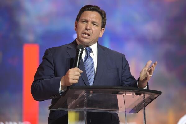 FILE - Florida's Republican Gov. Ron DeSantis addresses attendees during the Turning Point USA Student Action Summit, Friday, July 22, 2022, in Tampa, Fla. DeSantis' effort to place candidates fully aligned with his conservative views on school boards throughout the state is helping him expand his influence. Of the 30 candidates endorsed by DeSantis in the Aug. 23 elections, 19 won, five lost and six are headed to runoffs. (AP Photo/Phelan M. Ebenhack, File)
