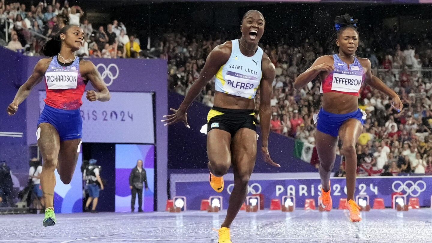 Olympics 2024: Julien Alfred upsets Sha'Carri Richardson, wins women's 100m gold | AP News