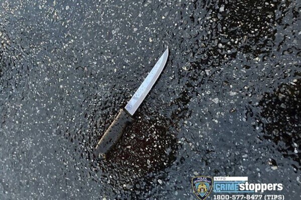 This photo provided by New York City Police Dept. shows a knife recovered at a crime scene in the far Rockaway section of the Queens borough of New York on Sunday, Dec. 3, 2023. A man killed four relatives, including two children, in a knife attack at their New York City home early Sunday, then set the building on fire and stabbed two police officers before one of them fatally shot him, officials said. (NYPD via AP)