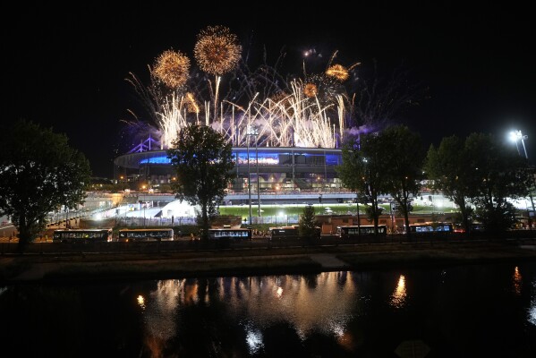 Fireworks signal the end of the 2024 Summer Olympics closing ceremony taking place at the Stade de France, Monday, Aug. 12, 2024, in Saint-Denis, France. (AP Photo/Alessandra Tarantino)