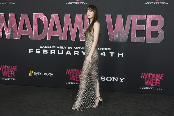 Dakota Johnson arrives at the premiere of "Madame Web," Monday, Feb. 12, 2024, at the Regency Village Theatre in Los Angeles. (Photo by Jordan Strauss/Invision/AP)