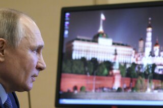 Russian President Vladimir Putin chairs a meeting with members of the Council for Interethnic Relations via video conference at the Novo-Ogaryovo residence outside Moscow, Russia, Tuesday, March 30, 2021. (Alexei Druzhinin, Sputnik, Kremlin Pool Photo via AP)