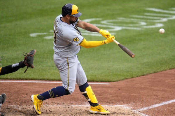 Milwaukee Brewers' Gary Sánchez hits a two-run home run off Pittsburgh Pirates relief pitcher Aroldis Chapman during the eighth inning of a baseball game in Pittsburgh, Thursday, April 25, 2024. The Brewers won 7-5. (AP Photo/Gene J. Puskar)