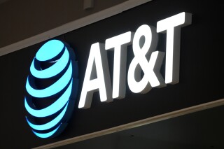 FILE - An AT&T sign is seen at a store in Pittsburgh, Monday, Jan. 30, 2023. AT&T said, Saturday, March 30, 2024, it has begun notifying millions of customers about the theft of personal data recently discovered online. (AP Photo/Gene J. Puskar, File)